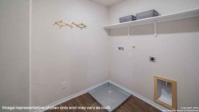 clothes washing area with hookup for a gas dryer, laundry area, washer hookup, wood finished floors, and electric dryer hookup