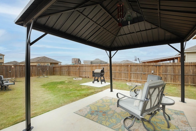 view of patio / terrace featuring a fenced backyard, a grill, and a gazebo