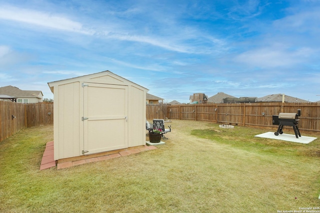 view of shed with a fenced backyard