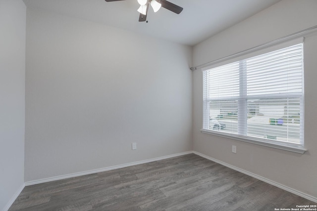 empty room featuring ceiling fan, wood finished floors, and baseboards