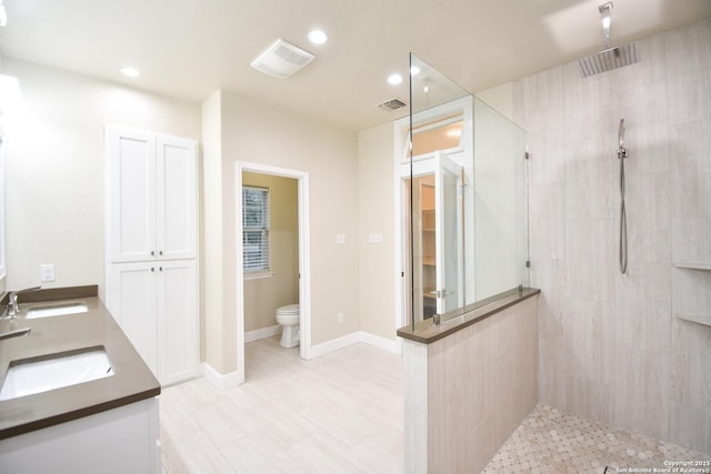 full bath featuring visible vents, a sink, and toilet