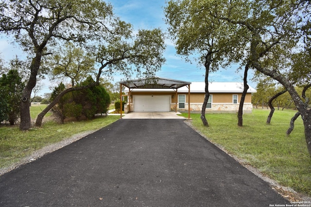 ranch-style home featuring stone siding, aphalt driveway, an attached garage, a front lawn, and stucco siding