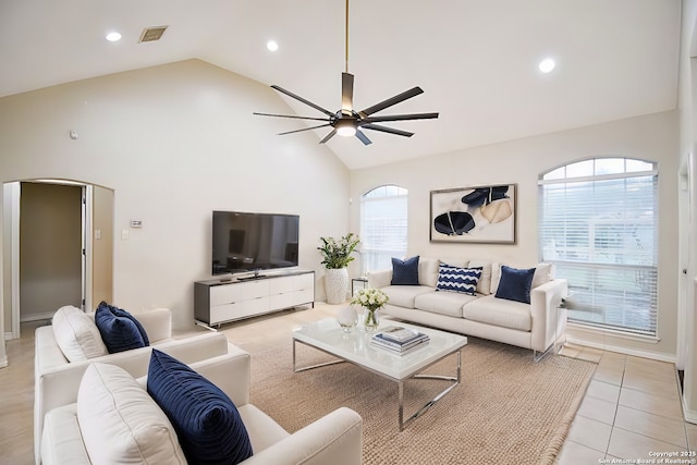 living room with light tile patterned floors, high vaulted ceiling, recessed lighting, visible vents, and a ceiling fan