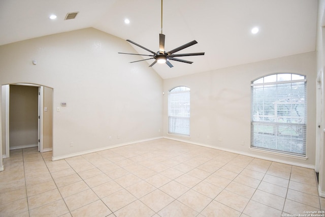 spare room featuring arched walkways, recessed lighting, visible vents, ceiling fan, and high vaulted ceiling