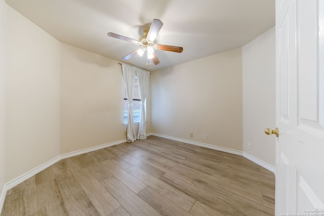 unfurnished room featuring a ceiling fan, baseboards, and light wood finished floors