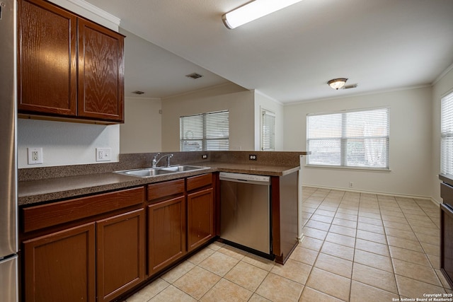 kitchen with visible vents, a sink, crown molding, dishwasher, and dark countertops