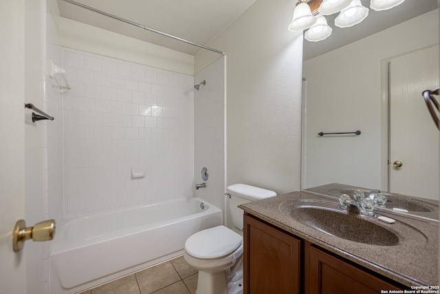 bathroom with vanity, tile patterned floors, toilet, and bathing tub / shower combination