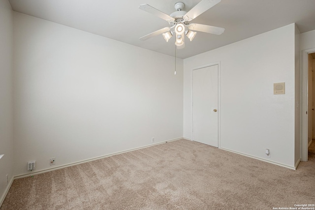 unfurnished room with carpet and ceiling fan