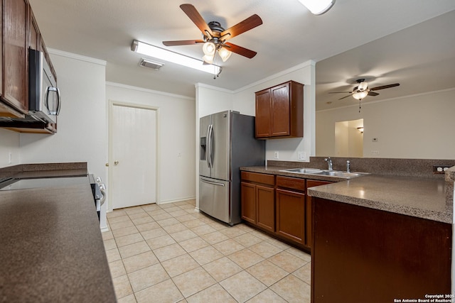 kitchen featuring ornamental molding, visible vents, appliances with stainless steel finishes, and a sink