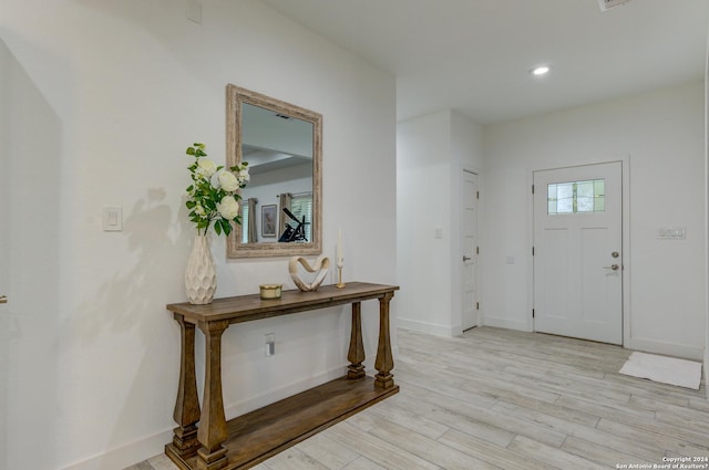 entryway featuring light wood-style floors, recessed lighting, and baseboards