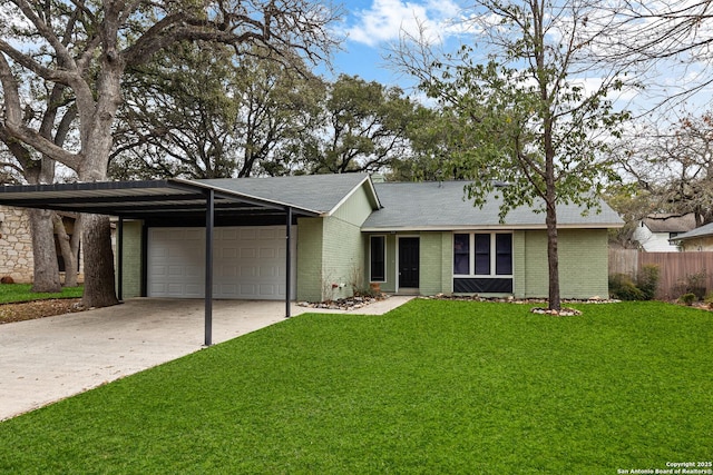 view of front of property featuring driveway, brick siding, an attached garage, and a front yard