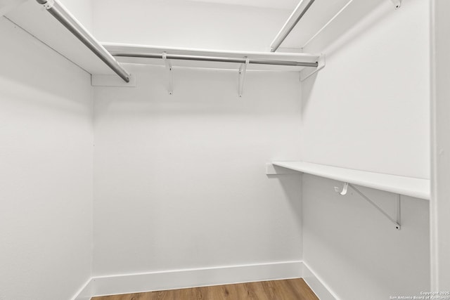 spacious closet with wood finished floors