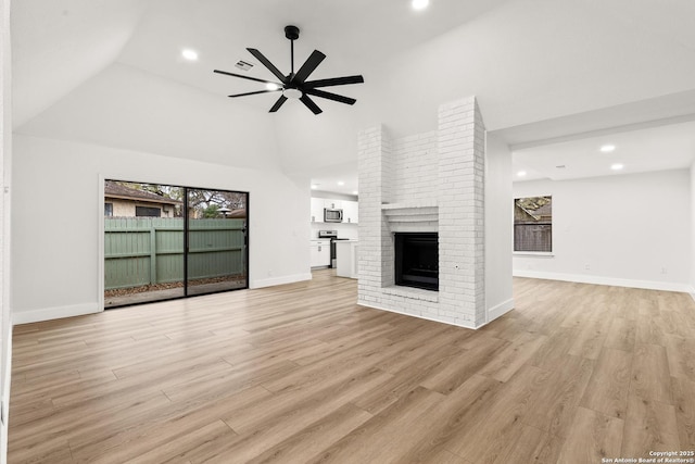 unfurnished living room featuring recessed lighting, a fireplace, a ceiling fan, baseboards, and light wood-style floors