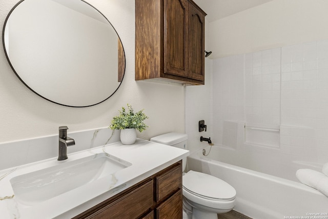 bathroom with shower / bath combination, vanity, and toilet