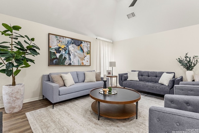 living room featuring baseboards, visible vents, ceiling fan, wood finished floors, and high vaulted ceiling