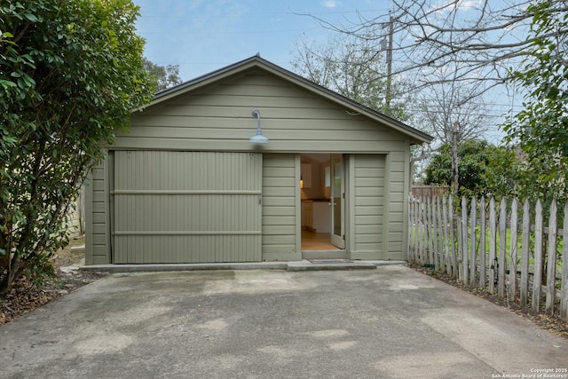 detached garage with fence