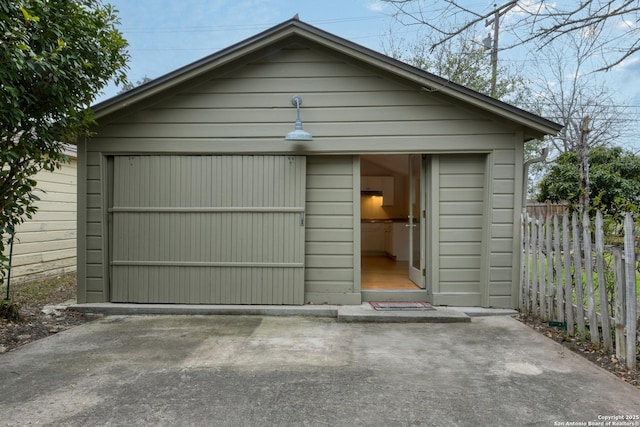 garage featuring fence