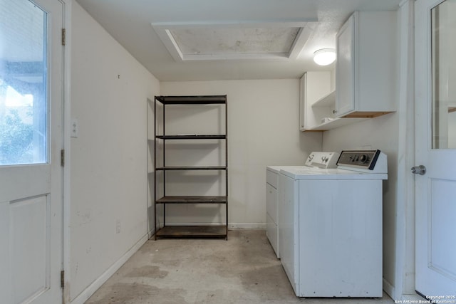 laundry area with attic access, cabinet space, independent washer and dryer, and baseboards