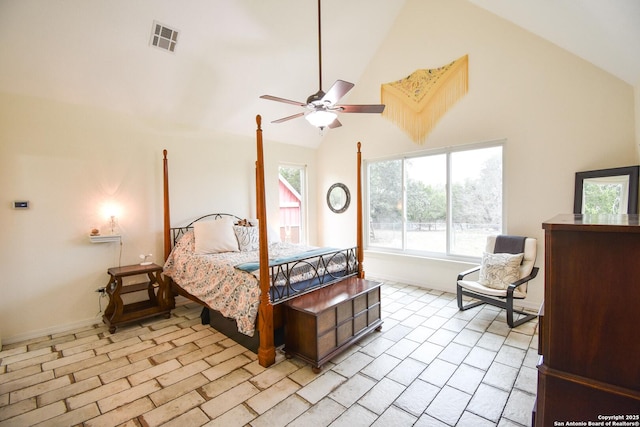 bedroom featuring ceiling fan, high vaulted ceiling, visible vents, and baseboards