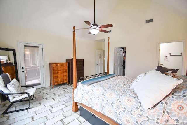 bedroom with high vaulted ceiling, connected bathroom, visible vents, a closet, and a walk in closet