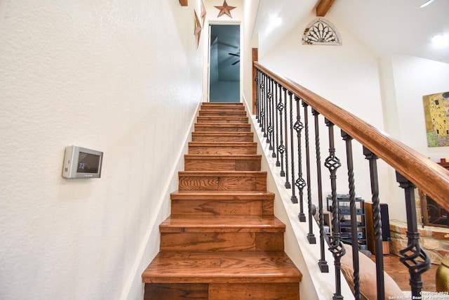 stairs with high vaulted ceiling, beamed ceiling, wood finished floors, and baseboards