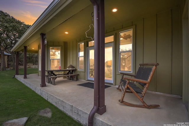 patio terrace at dusk with a yard