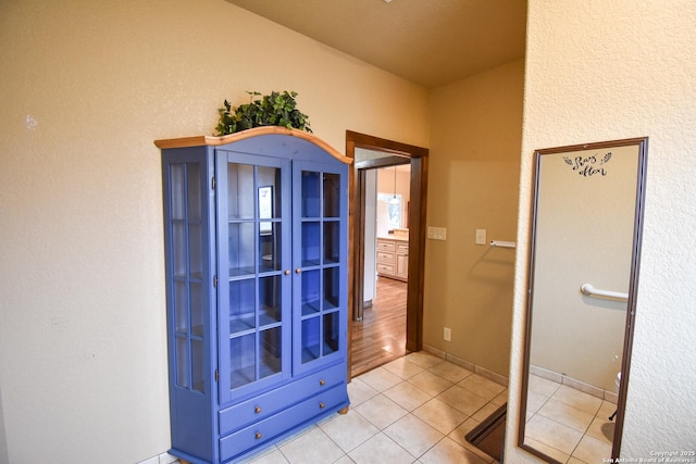 bathroom with tile patterned floors