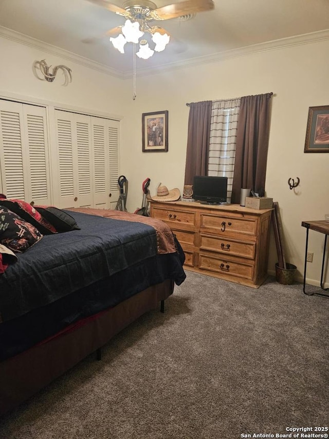 carpeted bedroom featuring ceiling fan and ornamental molding