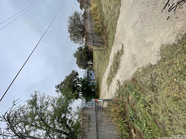 exterior space featuring driveway and a gated entry