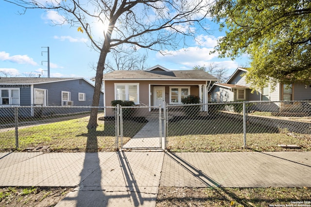 1814 Pasadena, San Antonio, TX 78201 - bungalow with a fenced front yard, a front yard, and a gate
