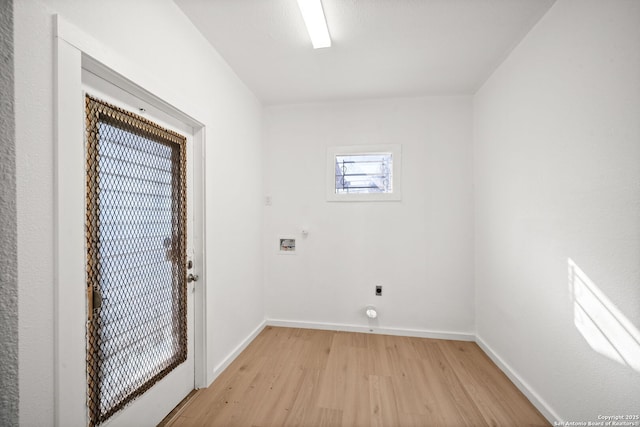 washroom with laundry area, gas dryer hookup, light wood-style flooring, washer hookup, and electric dryer hookup