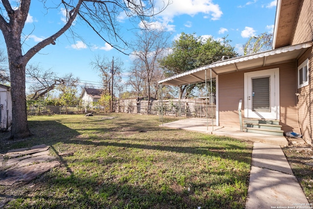 view of yard featuring entry steps, a patio, and fence private yard