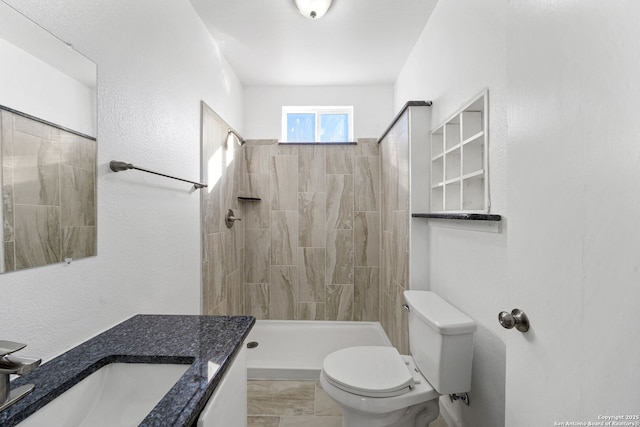 full bath with a shower stall, toilet, and vanity