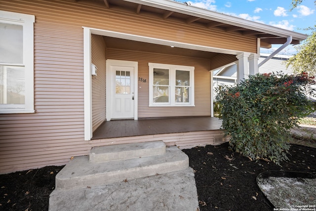 property entrance featuring covered porch