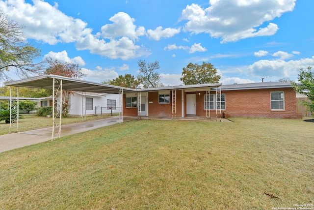 ranch-style house featuring an attached carport, brick siding, driveway, and a front lawn