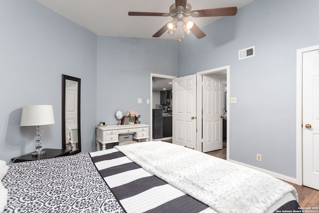 bedroom with baseboards, visible vents, a ceiling fan, dark wood-style floors, and high vaulted ceiling