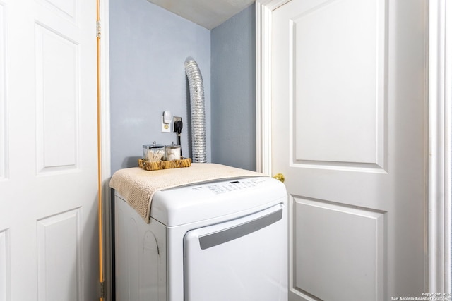 washroom featuring laundry area and hookup for an electric dryer