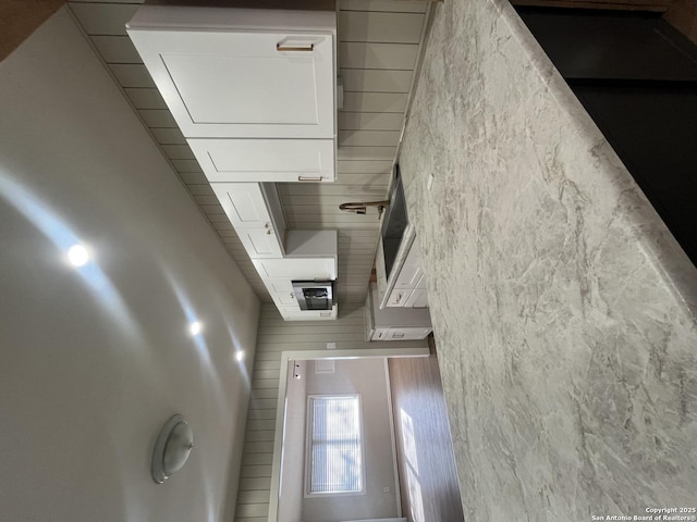 kitchen featuring white cabinets and light countertops