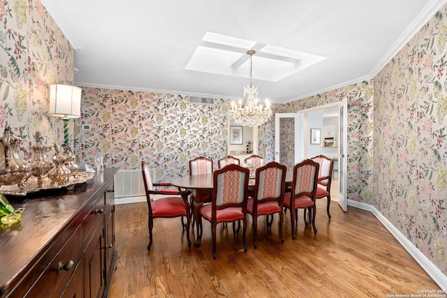 dining room with light wood-style flooring, baseboards, wallpapered walls, an inviting chandelier, and crown molding