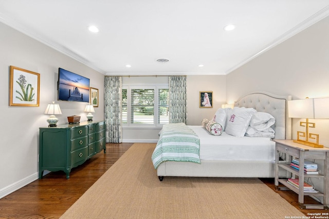 bedroom with baseboards, recessed lighting, wood finished floors, and crown molding