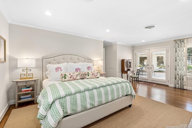 bedroom with visible vents, wood finished floors, access to outside, crown molding, and french doors