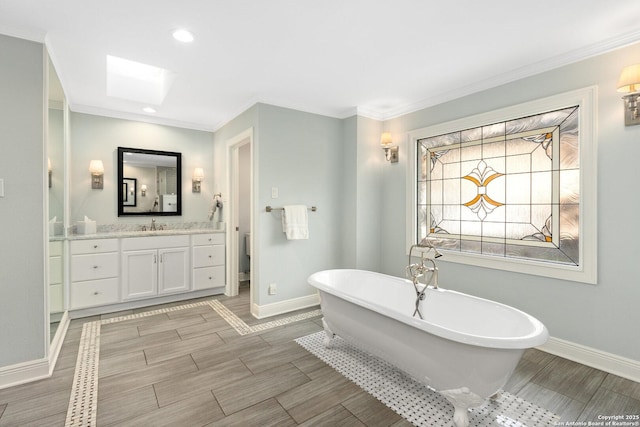 full bath with baseboards, a soaking tub, ornamental molding, wood tiled floor, and vanity