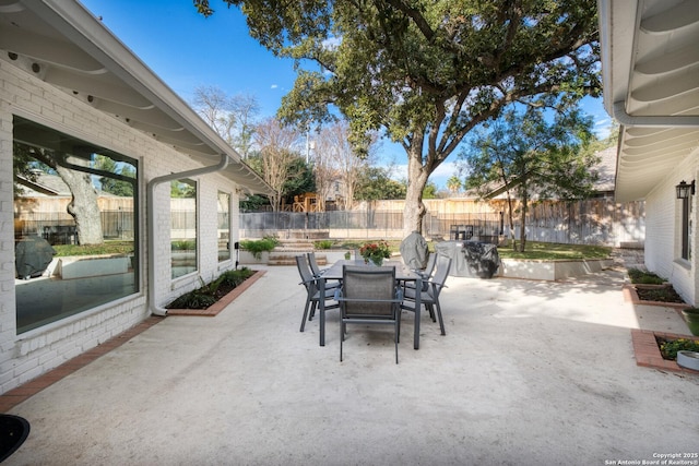 view of patio / terrace with outdoor dining space and a fenced backyard