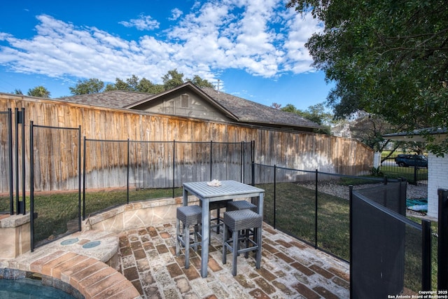 view of patio featuring outdoor dining space and a fenced backyard