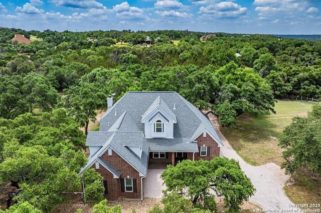 bird's eye view featuring a view of trees