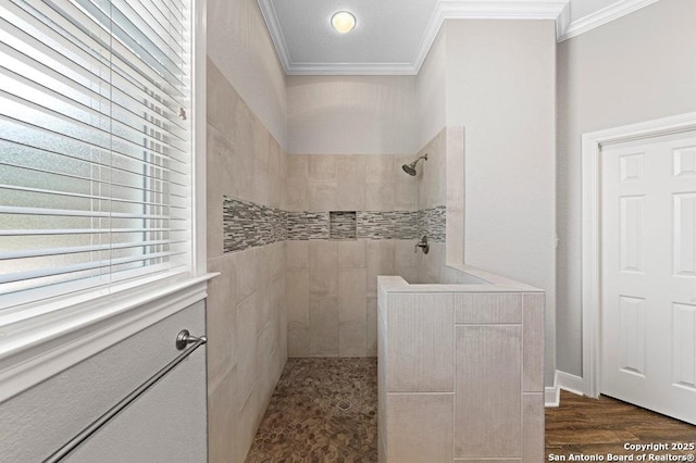 bathroom with a walk in shower, wood finished floors, and crown molding