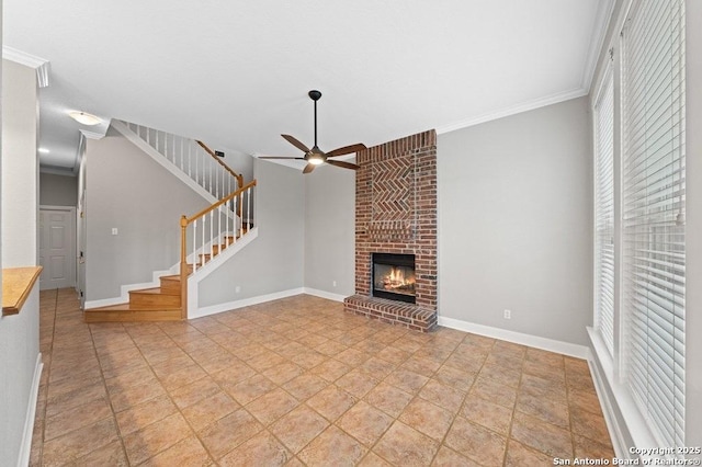 unfurnished living room with ceiling fan, a fireplace, stairway, and baseboards