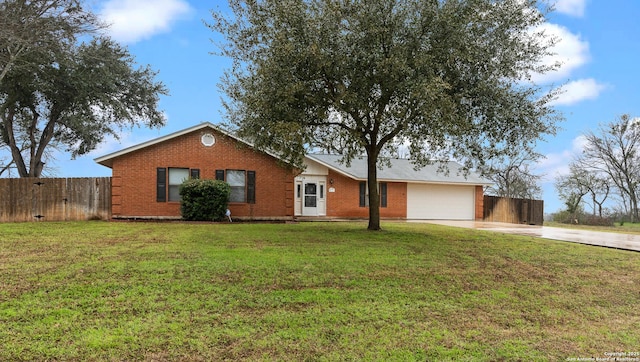 single story home featuring a garage, concrete driveway, fence, a front lawn, and brick siding