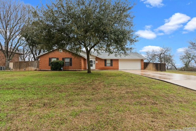 ranch-style home with driveway, an attached garage, fence, a front yard, and brick siding