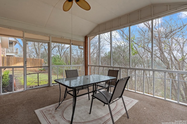 sunroom / solarium featuring lofted ceiling and ceiling fan